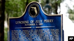 FILE- In this June 21, 2019 file photo, a historical marker was unveiled in Orlando, Fla. July Perry was lynched by a white mob after helping a friend trying to vote