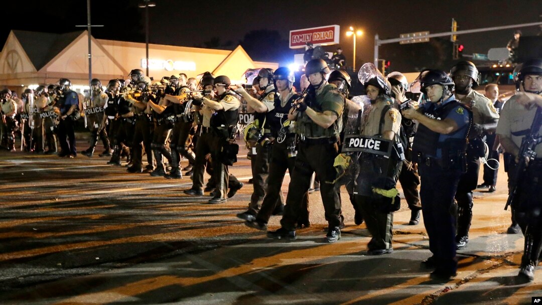 Police advance to clear the crowd, Ferguson, Missouri, Aug. 18, 2014