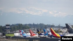 FILE - Various models of the Boeing 737 sit parked on the tarmac at Boeing Field after coming off the production line in Seattle, Washington, May 9, 2017. 