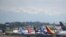 FILE - Various models of the Boeing 737 sit parked on the tarmac at Boeing Field after coming off the production line in Seattle, Washington, May 9, 2017. 