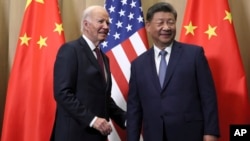 U.S. President Joe Biden and Chinese President Xi Jinping before a bilateral meeting in Lima, Peru, Nov. 16, 2024. (Leah Millis/Reuters Pool Photo via AP)