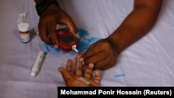 A person receives a blood sugar test for diabetes in Dhaka, Bangladesh on November 14, 2024. (REUTERS/Mohammad Ponir Hossain)