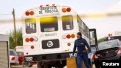 Investigating police officer leaves the scene where, according to local media, unknown assailants tried to set a bus on fire, in Ciudad Juarez.