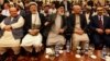 Afghan politicians, from second left to right, Mohammad Karim Khalili, Gulbuddin Hekmatyar, Haneef Atmar and Ustad Atta Mohammad Noor, and others attend the opening session of an Afghan Peace Conference in Bhurban, Pakistan, June 22, 2019.