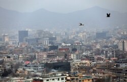 Birds flyover the city of Kabul on Jan. 31, 2021. In a report released Feb. 1, 2021, said Taliban attacks in the Afghan capital are on the rise, with increasing targeted killings of government officials, civil-society leaders and journalists.