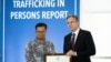 FILE - U.S. Secretary of State Antony Blinken stands with Mech Dara, a 2023 Trafficking in Persons Report Hero, for work in Cambodia at the State Department in Washington, June 15, 2023. 