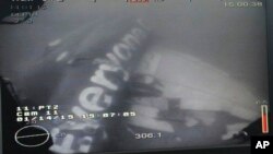 This undated underwater photo taken by a Remotely Operated Vehicle (ROV) and released by the Singapore Ministry of Defence (MINDEF) shows the wreckage of AirAsia Flight QZ 8501 lying on the sea floor in the Java Sea. 