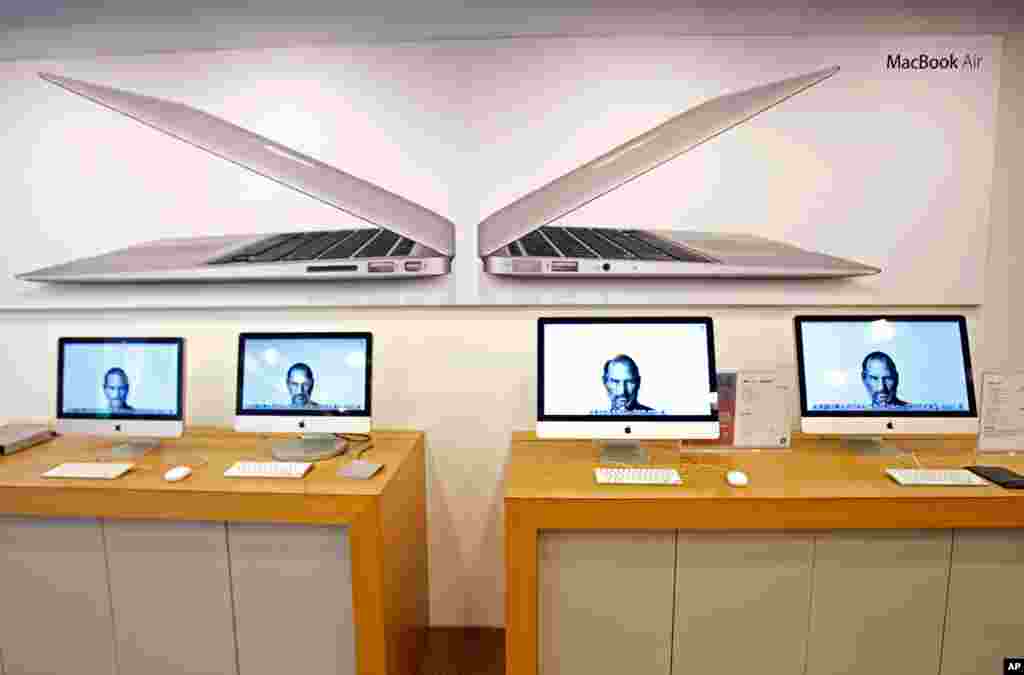 Portraits of the late Steve Jobs illuminate computer monitors in an Apple retail store in Taiwan, Oct. 6, 2011. (AP)