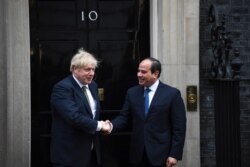 FILE - Britain's Prime Minister Boris Johnson, left, welcomes Egypt's President Abdel Fattah el-Sissi at 10 Downing Street, in London, Jan. 21, 2020, for a bilateral meeting.
