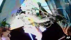 In this image taken from NASA video, NASA astronaut Chris Cassidy works outside the International Space Station on July 16, 2020.