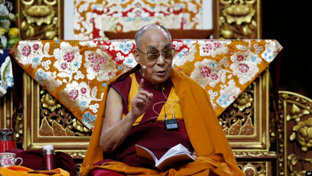 FILE - The Dalai Lama delivers his message as he attends a fair in Milan, Italy, Oct. 21, 2016.
