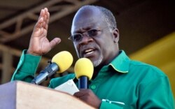 FILE - President John Magufuli gestures during a rally in Dar es Salaam, Tanzania, Oct. 23, 2015. Magufuli in a speech Jan. 27, 2021, scorned the idea of a lockdown to prevent the coronavirus from spreading and said vaccinations were dangerous.