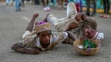 Followers of Saint Lazarus, known as the protector of the sick, crawl in self-imposed penance during a pilgrimage to the saint's shrine for his annual feast day, in Santiago de Las Vegas, Cuba, Dec. 16, 2024.