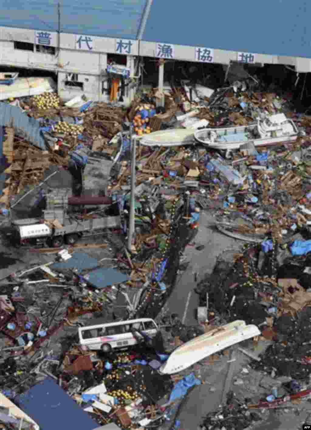 A market near a port is filled with debris in Fudai, Iwate, northern Japan Monday, March 14, 2011 following Friday's massive earthquake and the ensuing tsunami. (AP Photo/Yomiuri Shimbun, Hiroshi Adachi) JAPAN OUT, MANDATORY CREDIT