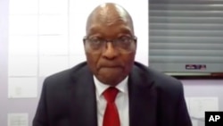 In this Frame grab former South Africa President Jacob Zuma, appears on a screen virtually from the correctional service facility Estcourt, in Pietermaritzburg, South Africa, July 19, 2021.