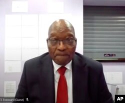 In this Frame grab former South Africa President Jacob Zuma, appears on a screen virtually from the correctional service facility Estcourt, in Pietermaritzburg, South Africa, July 19, 2021.