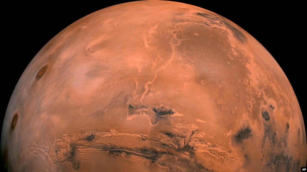 This image made available by NASA shows the planet Mars. It was created from over 100 images taken by Viking Orbiters in the 1970s. (NASA via AP)