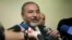 Former Israeli Foreign Minister Avigdor Lieberman speaks to journalists as he arrives to the weekly Cabinet meeting at the prime minister's office in Jerusalem, December 16, 2012.