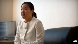 Xu Yan, the wife of Chinese lawyer Yu Wensheng, speaks during an interview in their apartment on the outskirts of Beijing, Jan. 19, 2018.