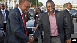 Before departing for AU summit in Addis Ababa, Kenyan President Kenyatta, left, with Deputy President Ruto, Nairobi, Kenya, Oct. 12, 2013.