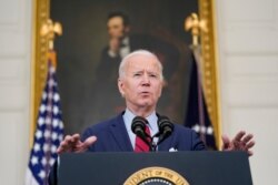 President Joe Biden speaks about the shooting in Boulder, Colorado, March 23, 2021, in the State Dining Room of the White House in Washington.