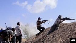 Libyan rebels attack government positions near Tripoli.