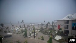 FILE - The Hotel Mercure in Marigot, near the Bay of Nettle, on the French Collectivity of Saint Martin, is seen during the passage of Hurricane Irma, Sept. 6, 2017.
