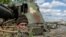 FILE PHOTO: An Ukrainian soldier looks out from a tank, amid Russia's invasion of Ukraine, in the frontline city of Lyman, Donetsk region