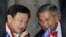 Cambodian Prime Minister Hun Sen, right, talks with former Thailand's Prime Minister Thaksin Shinawatra in Phnom Penh, file photo. 