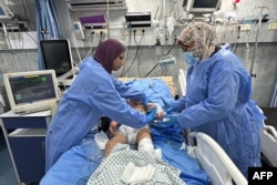 An injured child receives medical care at the emergency room in the Kamal Adwan Hospital in Beit Lahia the northern Gaza Strip, Oct. 24, 2024. The hospital is the only medical facility still partially functioning in the area targeted by Israel in October.