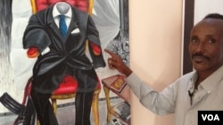 FILE - Somali artist Affey with his painting 'Empty Suit', representing diaspora politicians.