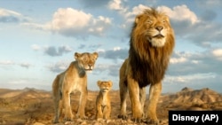 This image released by Disney shows characters Afia, voiced by Anika Noni Rose, left, Mufasa, voiced by Braelyn Rankins, center, and Masego, voiced by Keith David, in a scene from "Mufasa: The Lion King." 