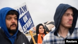 Union members in Spring Hill, Tennessee picket General Motors on Oct. 30, 2023. The company and the union reached a tentative deal Monday, ending the six-week campaign of coordinated strikes. 