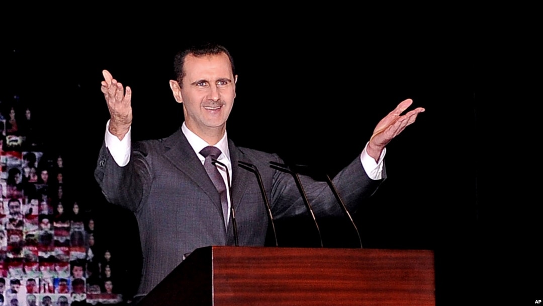 Tổng thống Syria Bashar al-Assad đọc diễn văn đầu tiên kể từ tháng 6 tại nhà hát lớn ở trung tâm thủ đô Damascus, ngày 6/1/2013.
