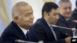 FILE - Uzbek President Islam Karimov is pictured during his meeting with U.S. Secretary of State John Kerry at the Palace of Forums in Samarkand, Uzbekistan, Nov. 1, 2015. 