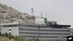 A rear part of the InterContinental hotel that caught on fire has turned to black after it was attacked by militants in Kabul, Afghanistan, June 29, 2011