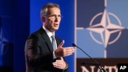 FILE - NATO Secretary General Jens Stoltenberg speaks during a media conference at NATO headquarters in Brussels, July 10, 2018.