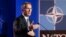 FILE - NATO Secretary General Jens Stoltenberg speaks during a media conference at NATO headquarters in Brussels, July 10, 2018.