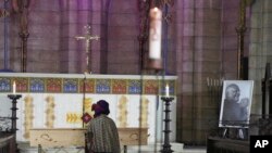 Mpho Tutu, sits with the coffin of her father Anglican Archbishop Emeritus Desmond Tutu during his funeral at the St. George&#39;s Cathedral in Cape Town, South Africa, Jan. 1, 2022.&nbsp;Tutu, the Nobel Peace Prize-winning activist for racial equality and LGBT rights died at the age of 90.