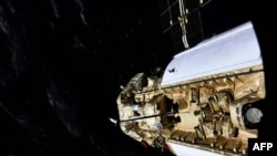 This handout photograph taken and released by the Russian Space Agency Roscosmos on July 29, 2021, shows the Russian Multipurpose Laboratory Module 'Nauka' (Science) docking to the International Space Station.
