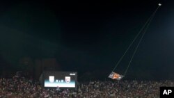 FILE - A drone with an Albanian flag flies over Partizan stadium during the Euro 2016 Group I qualifying match between Serbia and Albania in Belgrade, Serbia, Oct. 14, 2014. 