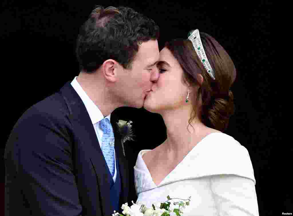 Britain's Princess Eugenie and Jack Brooksbank kiss as they leave after their wedding at St George's Chapel in Windsor Castle, Windsor, Britain Oct. 12, 2018.