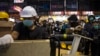 Pro-democracy protesters set up a new road block during a confrontation with riot police at Mong Kok shopping district in Hong Kong, Nov. 25,2014.