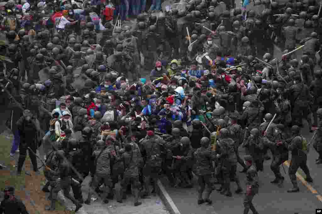 Honduran migrants clash with Guatemalan soldiers in Vado Hondo, Guatemala. Authorities estimated that as many as 9,000 Honduran migrants crossed into Guatemala as part of an effort to form a new caravan to reach the U.S. border.&nbsp;