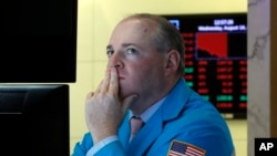 Specialist Edward Loggie works on the floor of the New York Stock Exchange, Aug. 14, 2019. 