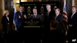 U.S. Senator Lindsey Graham, center, speaks as senators from left Maggie Hassan, Jeff Flake, Bill Cassidy, Chris Coons and Cory Gardner stand during a press conference in Jerusalem, Feb. 22, 2018. 