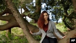 Climate activist Jamie Margolin poses for a portrait in a tree in Seattle on April 5, 2020. 