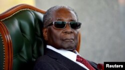 FILE - Zimbabwe's former president Robert Mugabe looks on during a press conference at his private residence nicknamed "Blue Roof" in Harare, Zimbabwe, July 29, 2018.