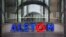 FILE - The company logo of Alstom is shown at the headquarters of the leading global maker of high-speed trains, power plants and grids, in Levallois-Perret, outside Paris, France, April 30, 2014. U.S Justice Department officials on Dec. 22, 2014, announced the French power and transportation company has agreed to pay $772 million in penalties to resolve allegations that it bribed government officials in multiple foreign countries and would plead guilty to violating the Foreign Corrupt Practices Act.