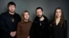 FILE - From left, photographer Evgeniy Maloletka, "Frontline" producer Michelle Mizner, director Mstyslav Chernov and field producer Vasilisa Stepanenko pose for a portrait to promote "20 Days in Mariupol" during the Sundance Film Festival on Jan. 22, 2023, in Park City, Utah.